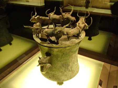 bronze vessel with eight yaks on top
